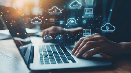 Fototapeta premium Person Working On Laptop With Cloud Computing Graphic Overlay