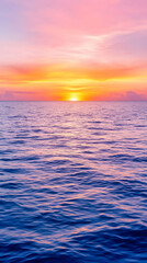 Obraz premium Vibrant sunset over calm ocean waters