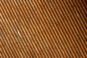 Light reflecting on diagonal grooves revealing intricate texture, creating dynamic interplay...