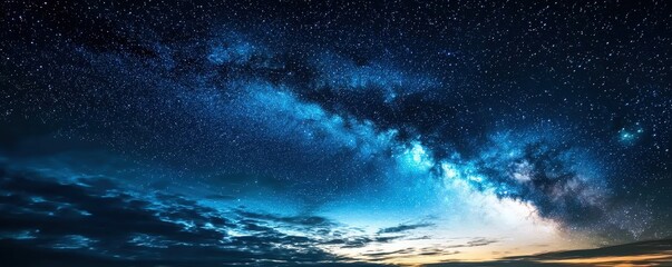 Fototapeta premium Breathtaking Night Sky with Milky Way and Stars Over Serene Landscape at Dawn