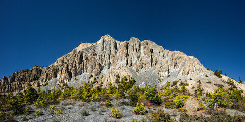 Panoramic view of the rock formation (weathered stone pillars) in Marsyangdi river valley between Ngawal and Bhraka villages. Annapurna circuit trek, Nepal.