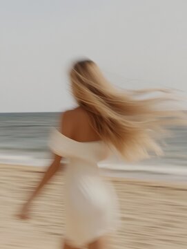 Faceless Hair model running on beach with golden hair flowing in wind, minimalist summer aesthetic &mdash; editorial content for hair branding, social media, Instagram, websites, and content marketing