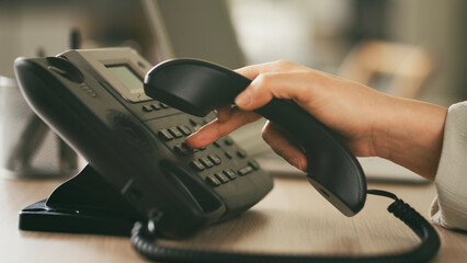 Headset and dialing a telephone in call center office concept , call center and customer service help desk
