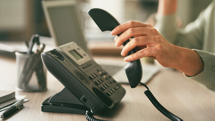 Headset and dialing a telephone in call center office concept , call center and customer service...