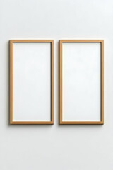 Two blank, light-wood framed posters on a white wall
