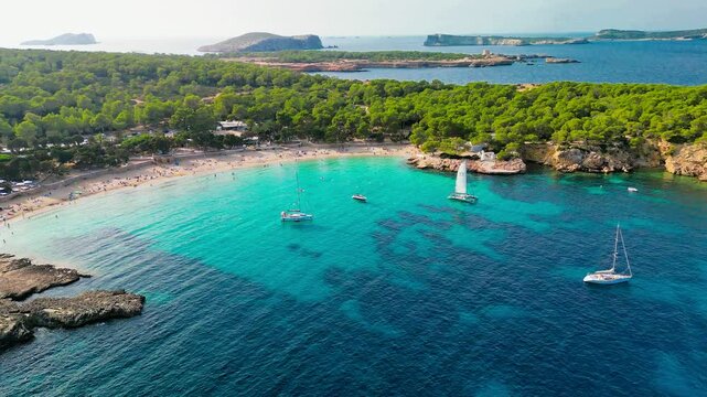 Ibiza Cala Bassa beach with turquoise water, aerial views