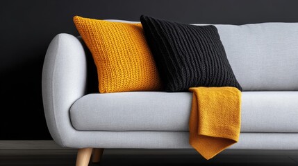 Modern living room with gray sofa and colorful knitted throw pillows