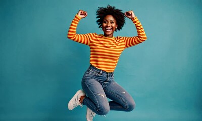 Super slow motion young black woman jumping with hands up, expressing joy and excitement, dressed casually in a fun, happy pose