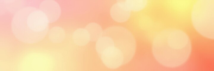 Beautiful warm bokeh background with soft glowing light in a gradient of orange and yellow hues