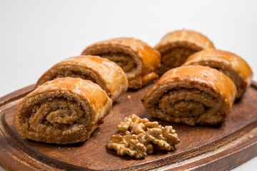 Walnut Roll Cake Slices on White Background