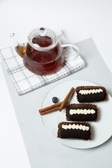 Chocolate Potato Cake with Cream and Teapot of Tea