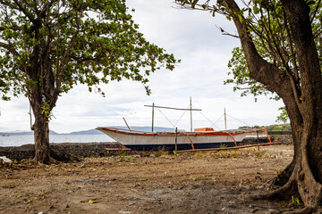 boat moored on a sandy beach