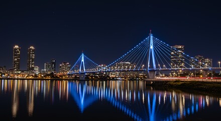 Fototapeta premium Illuminated Cable-Stayed Bridge over City at Night