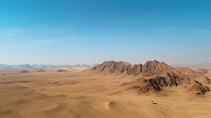 Desert Landscape With Rocky Mountains Under Clear Sky