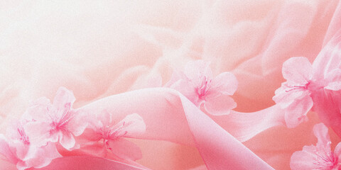 Soft pink floral background with delicate petals and flowing fabric in a gentle light setting