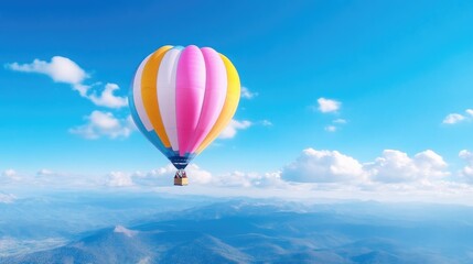 Fototapeta premium Colorful hot air balloon over mountains