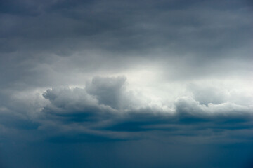 Landscape photography in the rainstorm , beautiful clouds in the sky , big and stormy clouds , forest and field , powerlines on the field,landscape photo