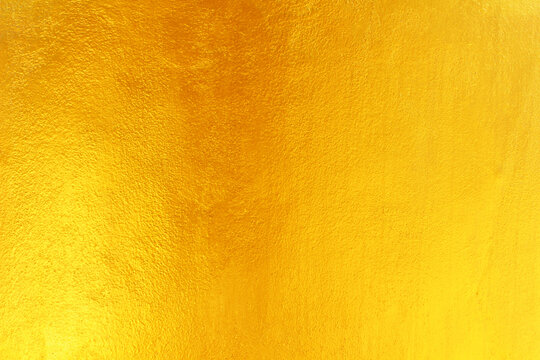 Gold paint on cement wall texture