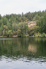 Thetis lake at Thetis Lake Regional Park calm water and overcast day