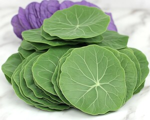 Fototapeta premium Stacked Green Leaves on Marble