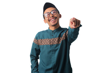 Naklejka premium Confident Asian Muslim man pointing at the camera with a positive and cheerful smile, isolated on a white background
