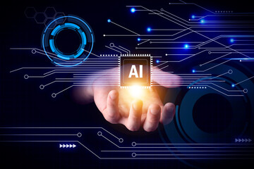 Artificial intelligence. Man holding virtual circuit board pattern with AI abbreviation on dark...