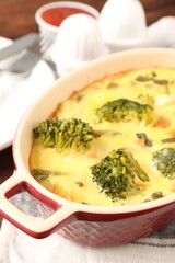 Delicious vegetable casserole on wooden table, closeup