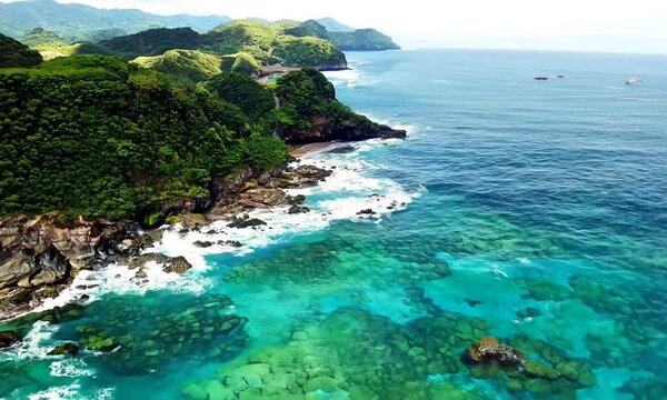 Seaside exploration natural landscape shore cliffs ocean west coast coastline scenic nature aerial drone view clear sea waves tourism island tour hiking preservation reef tropical journey