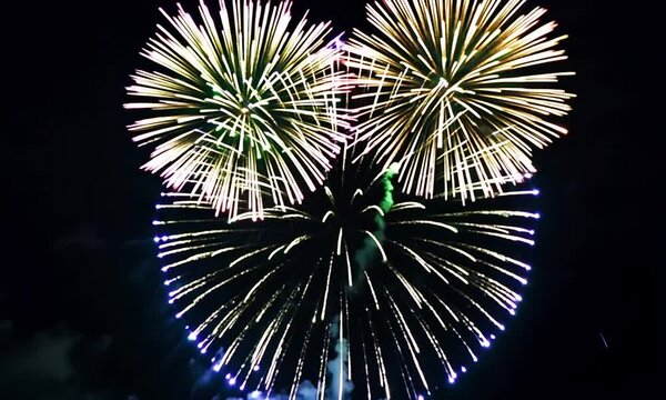 Flying abstract lines of fireworks of green tones on a black background. Motion. Concept of celebration and holidays.