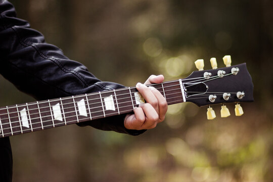 Close up detail of guitar strings and neck