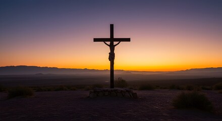 Silhouette of Christ on the Cross at sunset against the desert sky
