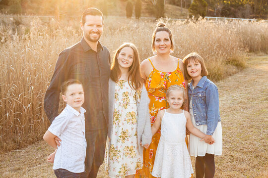 Portrait of family of six with four children