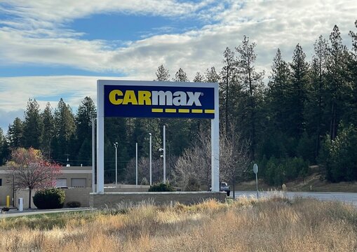 Spokane, WA/USA - March 16, 2025 : Exterior sign at a CarMax auto dealership.  CarMax is the largest used car retailer in the United States.