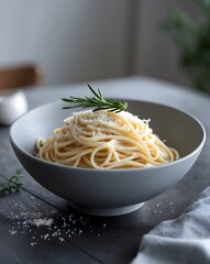 Appetizing bowl of creamy spaghetti featuring grated parmesan cheese and aromatic rosemary, presented on a rustic wooden table, ideal as a high-quality banner for restaurant advertisements