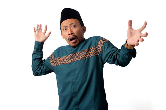 Scared Asian Muslim man, expressing fear and fright. Isolated on a white background