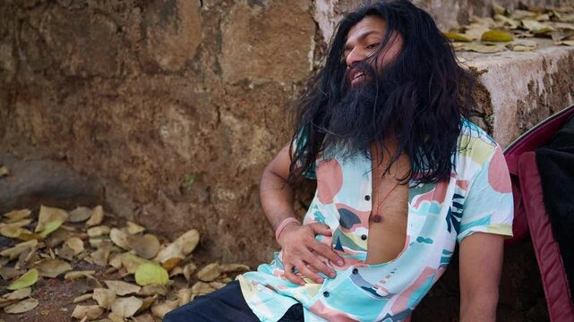 Wounded man sits holding his stomach at retreat