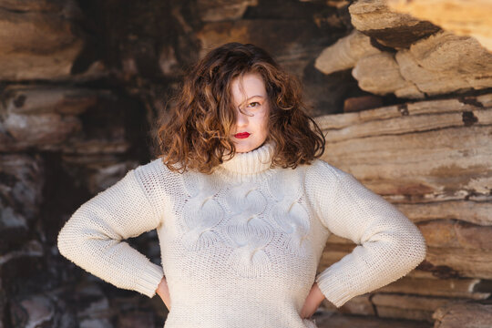 curvy woman wearing white sweater