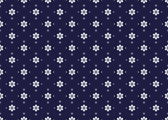 ethnic fabric seamless pattern with white flowers on a dark blue background. design for cloth, carpet, batik, wallpaper, wrapping etc.