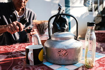 People morning talk with drip brewing coffee by paper filtered on table