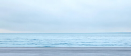 Calm ocean view with soft waves and overcast sky at serene coastal location