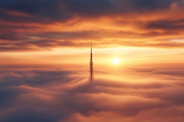 Obraz premium Riga Radio and TV Tower emerging from fog at sunset, aerial view