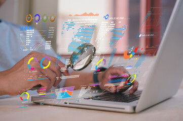 businessman holding magnifying glass looking at virtual data chart dashboard in concept of...