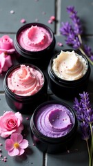 Jars with lavender and flower body scrub on grey background