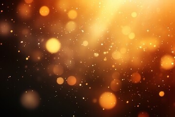 Obraz premium Golden bokeh lights creating a warm and glowing abstract background.