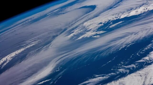 Flyby animation of a gold satellite in orbit revealing the cloudy Earth below