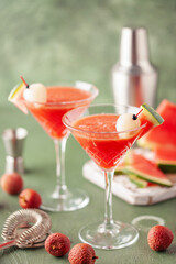 Cold watermelon lychee cocktails  in martini glasses. Summertime refreshment.