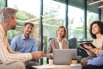 Group of happy progressive business people working on startup together at creative office