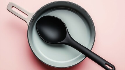 Matte black silicone ladle in a light grey minimalist saucepan on pastel background
