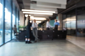 Blurred office background with employees