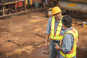 Construction engineer team working together join teamwork talking together at construction site
